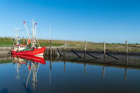 Red fishing boat in the southern harbor