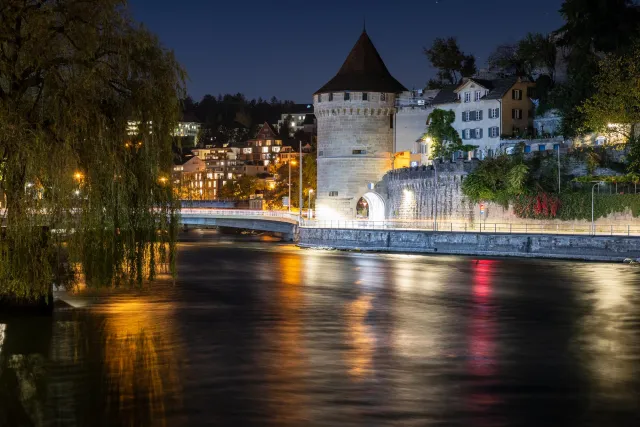 The Nölli tower, a round stone boss on the banks of the Reuss in Lucerne